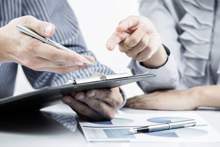 Business people discussing during a meeting on tableの写真素材