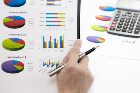 Stock market graphs and charts with penの写真素材