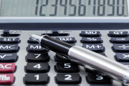 close up of calculator with penの写真素材