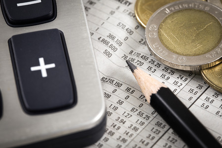 Business diagram on financial report with coins. Accountingの写真素材