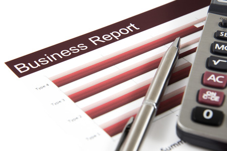business and financial report with calculator and penの写真素材