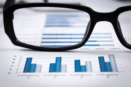 closeup glasses on financial reportの写真素材