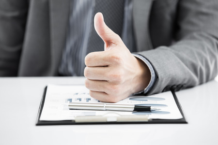 business report and man hand with pen. Accountingの写真素材