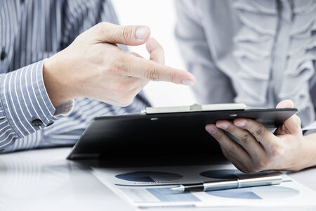 Business people discussing during a meeting on tableの写真素材