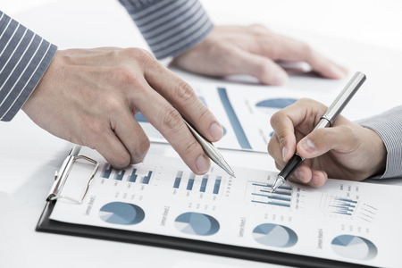 Business people discussing during a meeting on tableの写真素材