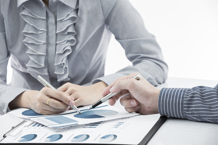 Business people discussing during a meeting on tableの写真素材