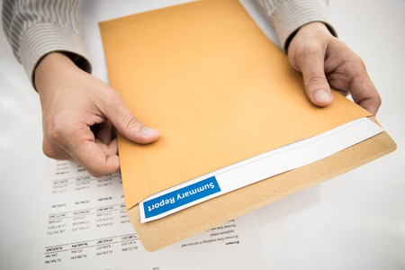 man hand with pen and business report. Accountingの写真素材