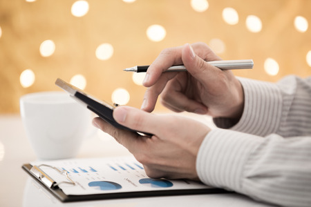 Business report and man hand with pen. Accountingの写真素材