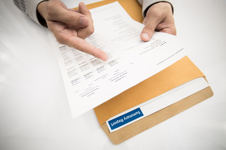 man hand with pen and business report. Accountingの写真素材