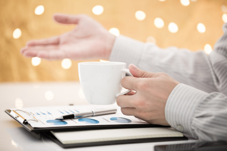 Business report and man hand with pen. Accountingの写真素材