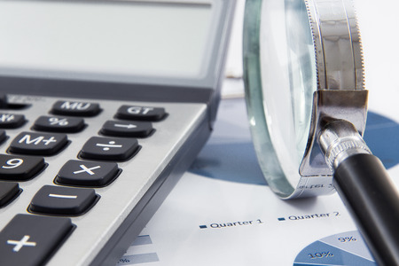 magnifying glass on the business report. Accountingの写真素材