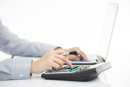 Business woman analyzing investment charts with laptop. Accountingの写真素材