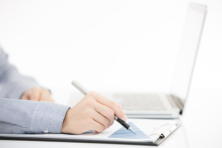 Business woman analyzing investment charts with laptop. Accountingの写真素材