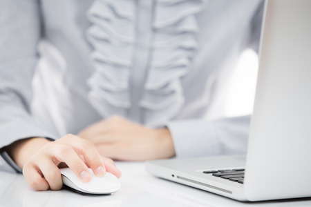 Business lady typing on laptopの写真素材