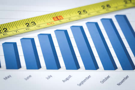 Showing business with financial report and measuring tape. Accounting