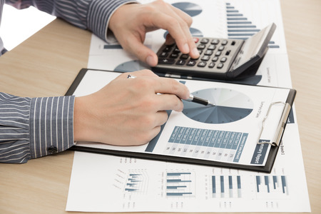 man hand with pen and business report. Accountingの写真素材