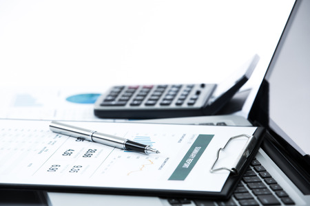 Businessman analyzing investment charts with laptop. Accountingの写真素材