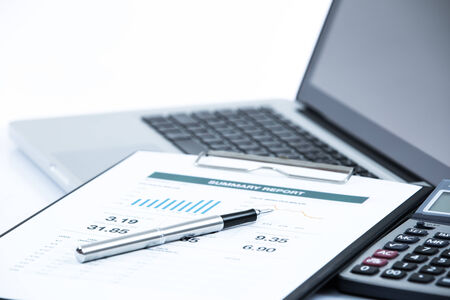 Businessman analyzing investment charts with laptop. Accountingの写真素材