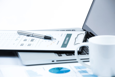 Businessman analyzing investment charts with laptop. Accountingの写真素材