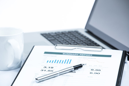Businessman analyzing investment charts with laptop. Accountingの写真素材