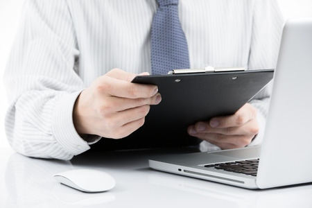 Businessman analyzing investment charts with laptop. Accountingの写真素材