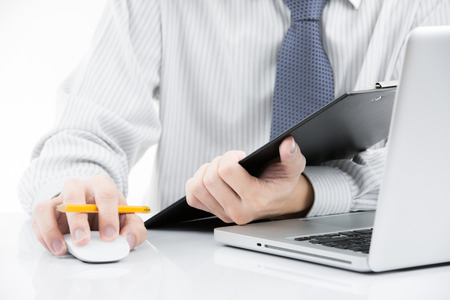Businessman analyzing investment charts with laptop. Accountingの写真素材