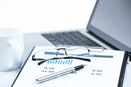 Businessman analyzing investment charts with laptop. Accountingの写真素材