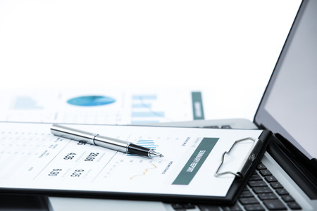 Businessman analyzing investment charts with laptop. Accountingの写真素材