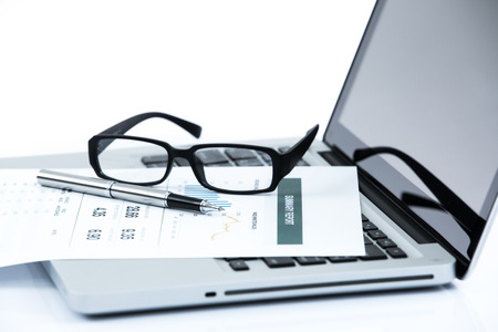 Businessman analyzing investment charts with laptop. Accountingの写真素材