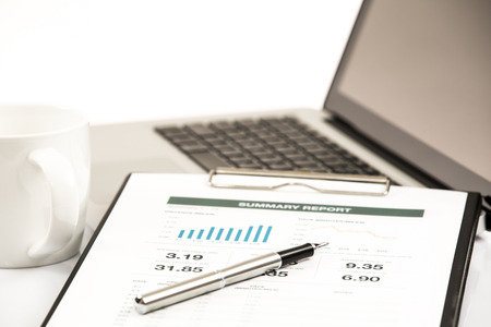Businessman analyzing investment charts with laptop. Accountingの写真素材