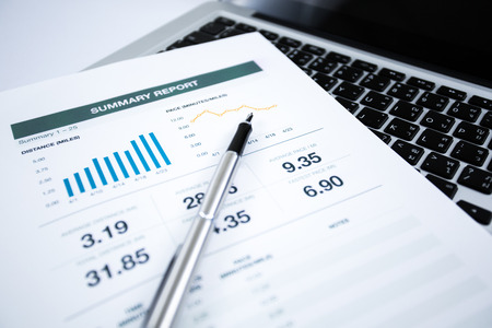 Businessman analyzing investment charts with laptop. Accountingの写真素材