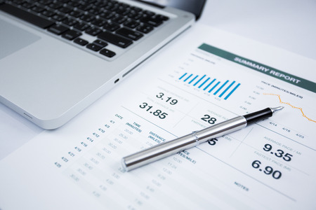 Businessman analyzing investment charts with laptop. Accountingの写真素材