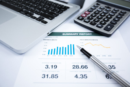 Businessman analyzing investment charts with laptop. Accountingの写真素材