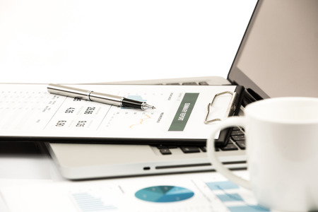 Businessman analyzing investment charts with laptop. Accountingの写真素材