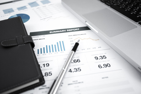 Businessman analyzing investment charts with laptop. Accountingの写真素材