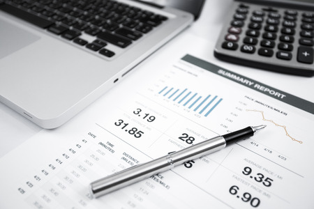 Businessman analyzing investment charts with laptop. Accountingの写真素材