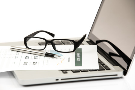 Businessman analyzing investment charts with laptop. Accountingの写真素材