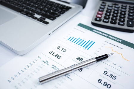 Businessman analyzing investment charts with laptop. Accountingの写真素材