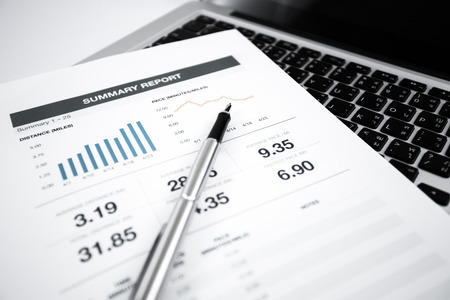 Businessman analyzing investment charts with laptop. Accountingの写真素材