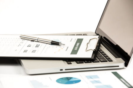 Businessman analyzing investment charts with laptop. Accountingの写真素材