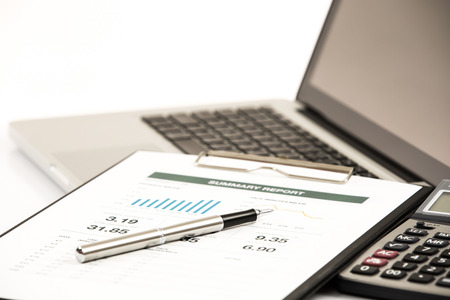Businessman analyzing investment charts with laptop. Accountingの写真素材