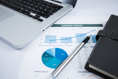 Businessman analyzing investment charts with laptop. Accountingの写真素材