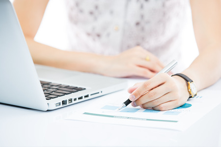 Hands of business woman with laptop computer keyboardの写真素材