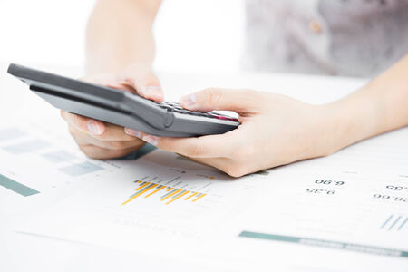 woman hand with pen and business reportの写真素材