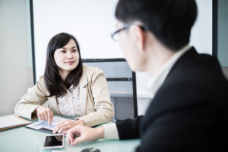 Successful young business executives meeting at the office.Asianの写真素材