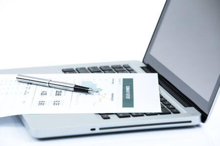Businessman analyzing investment charts with laptop. Accountingの写真素材