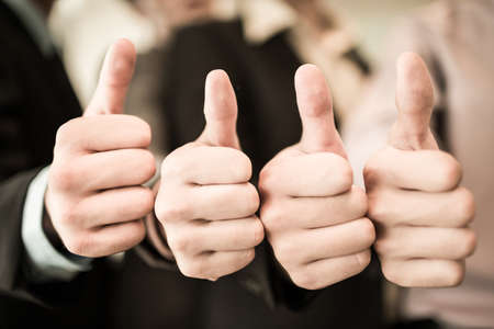 Group of hands with thumbs up expressing positivity.Asianの写真素材
