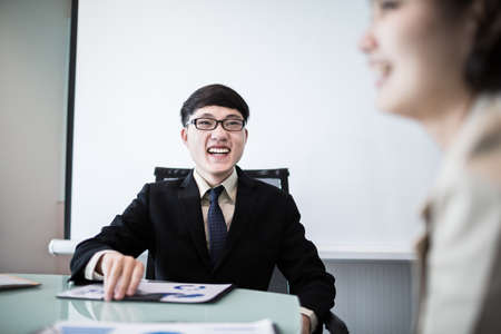 Successful young business executives meeting at the office.Asianの写真素材