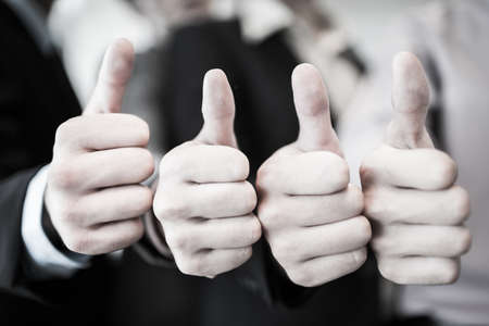 Group of hands with thumbs up expressing positivity.Asianの写真素材