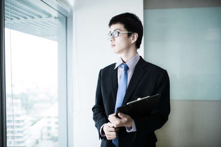 happy young business man work in modern office.Asianの写真素材